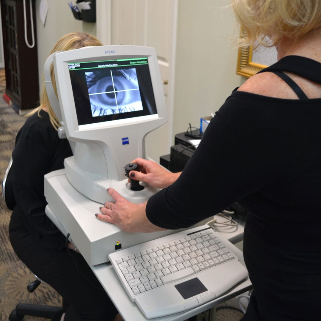 Woman scanning a patient’s eye