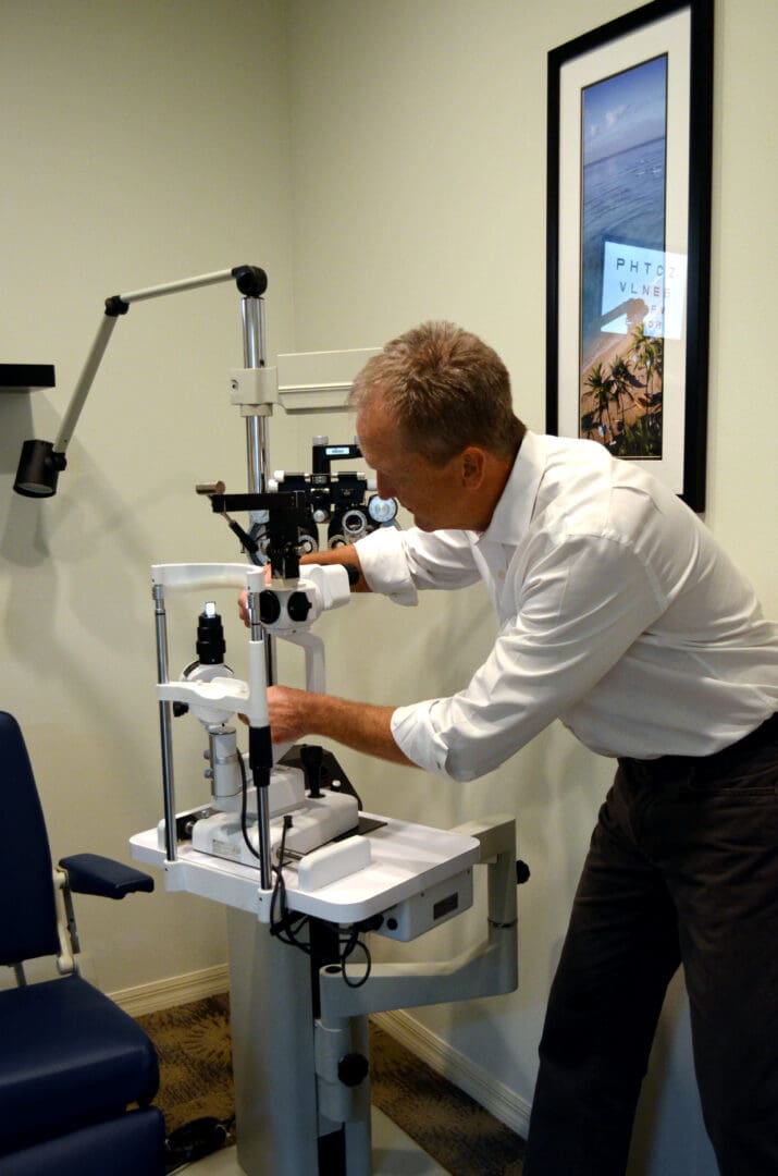 Doctor setting up an eye-testing machine